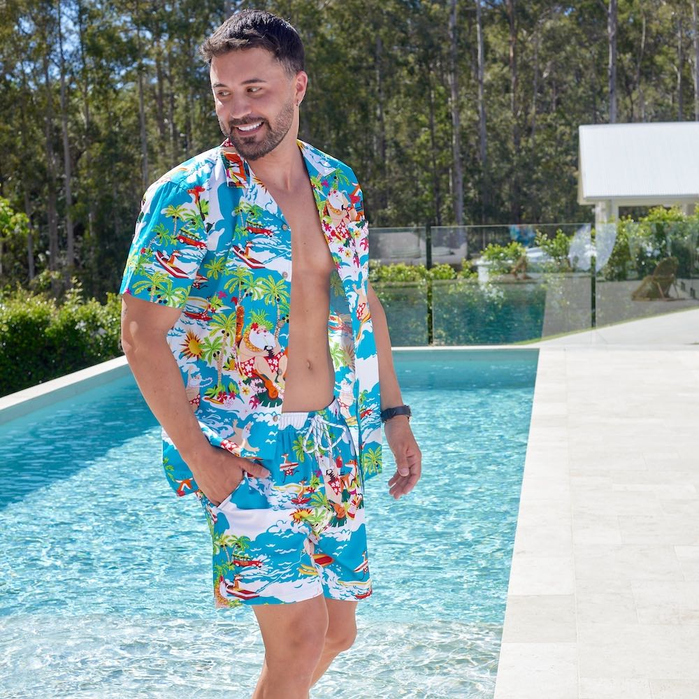 Stay cool and stylish this holiday season with the Blue Surfing Santa Hawaiian Shirt & Shorts! This unique men's outfit features a festive Hawaiian shirt and shorts combo that features a charming print of Santa surfing on some fun waves. Don't miss out on this perfect Christmas look!