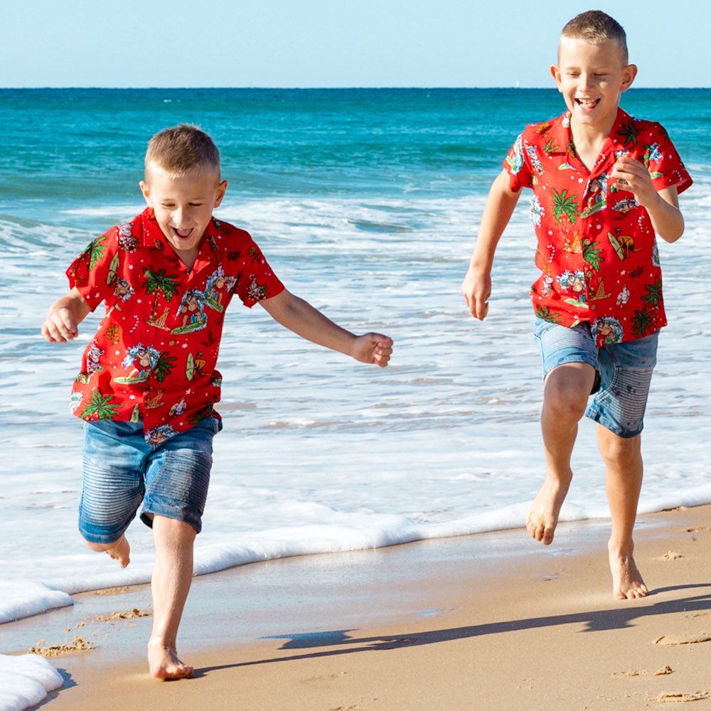 Make Christmas one to remember with our Aussie Christmas Red Festive Shirt! Perfect for all your little mini-mes, this unisex 100% rayon shirt features a red base with a fun surfing santa, aussie animals and flowers motif. Ho ho ho!