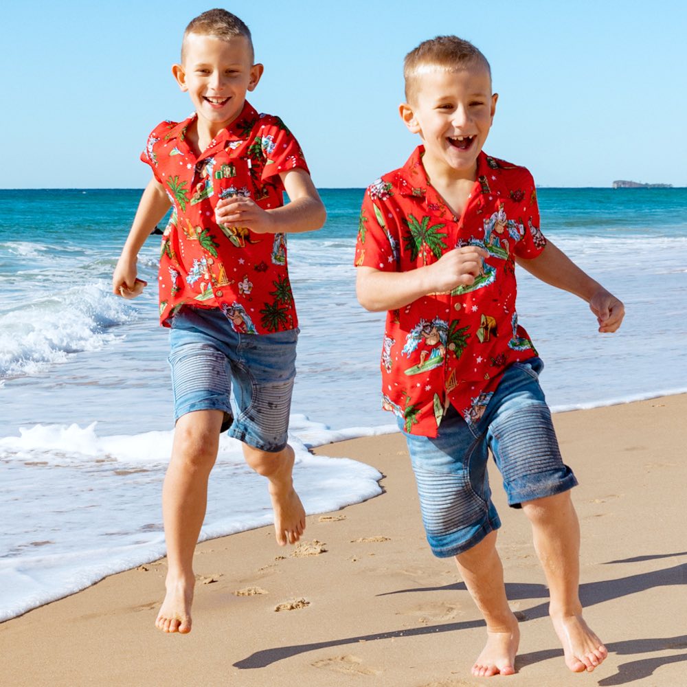 Make Christmas one to remember with our Aussie Christmas Red Festive Shirt! Perfect for all your little mini-mes, this unisex 100% rayon shirt features a red base with a fun surfing santa, aussie animals and flowers motif. Ho ho ho!