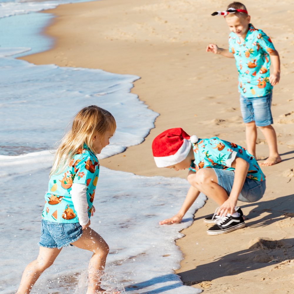 Spread some holiday cheer in this festive Christmas Pool Party shirt! Its 100% cotton fabric makes it ideal for boys and girls, while the bright and bubbly design featuring Santa, flamingos, and other Christmas elements is sure to make a splash! Don't miss out, hit the pool party! 🎉