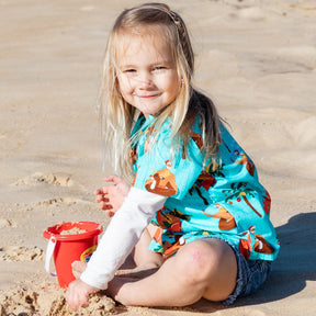 Spread some holiday cheer in this festive Christmas Pool Party shirt! Its 100% cotton fabric makes it ideal for boys and girls, while the bright and bubbly design featuring Santa, flamingos, and other Christmas elements is sure to make a splash! Don't miss out, hit the pool party! 🎉