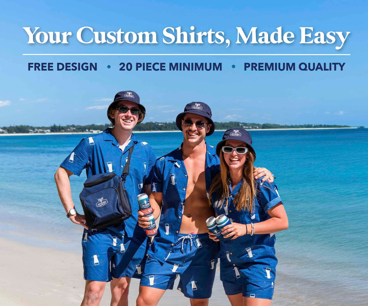 Three people in matching blue shirts and hats on a beach with text about custom shirts.