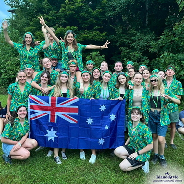 Group of scouts wearing ZHP Australia USA Jamboree custom shirts, posing with Australian flag in forest setting, showcasing team apparel.