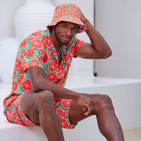 Bringing you the perfect way to top off your show-stopping Festival 'fit. Get two for the price of one with our reversible bucket hats. One side is our Groovy Grapefruit and the other side is our Shake Ya Melons. Pimm's o'clock is approaching; you pour, we've prepped the fruit.  Level up the look with matching Shirts and Shorts. View the Groovy Grapefruit Collection.  ONE SIZE - 60cm Circumference