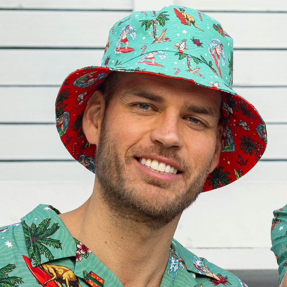 Dive into the festive spirit with this Aussie Christmas Green Bucket Hat! Whether you turn it one way or the other, you'll be spreading cheer and keeping the sun out of your eyes with its reversible design. Also features a removable chin strap.  So, get your hat on and get ready for a ho-ho-holiday season! Green one side and Red the other. Make a list....check it twice...then place your order with Island Style Clothing.