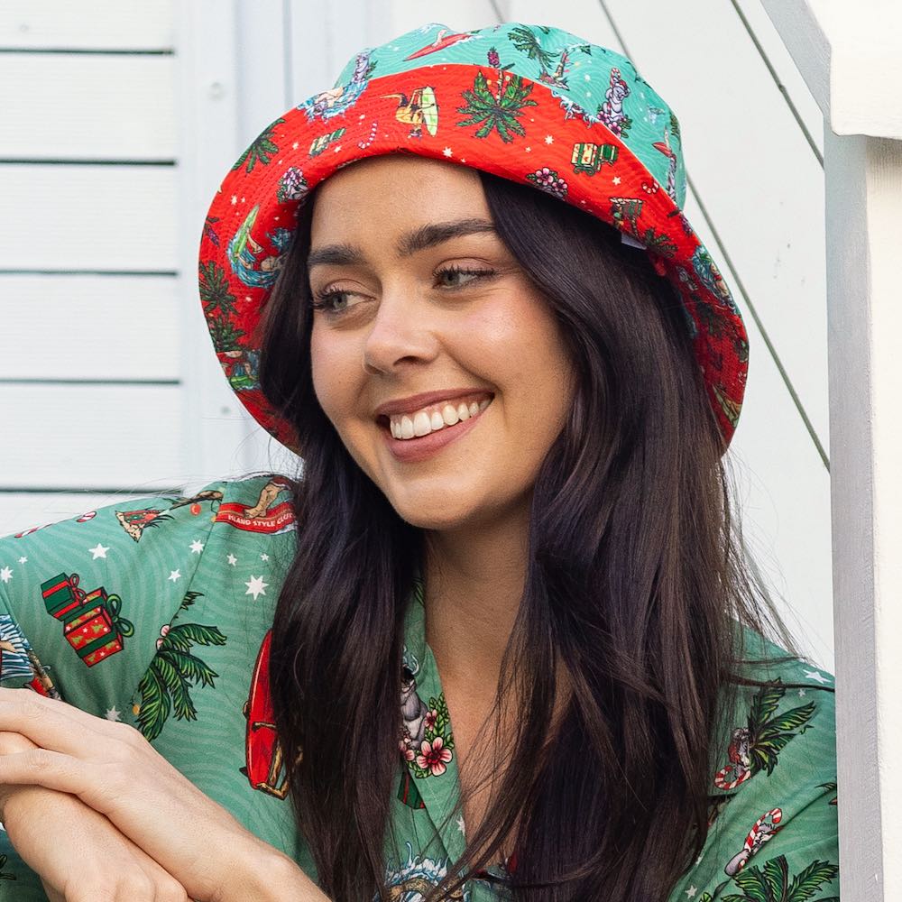 Dive into the festive spirit with this Aussie Christmas Green Bucket Hat! Whether you turn it one way or the other, you'll be spreading cheer and keeping the sun out of your eyes with its reversible design. Also features a removable chin strap.  So, get your hat on and get ready for a ho-ho-holiday season! Green one side and Red the other. Make a list....check it twice...then place your order with Island Style Clothing.