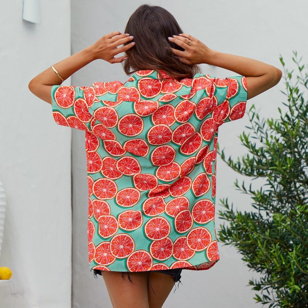 Looking for something fun and fruity? Check out our Groovy Grapefruit shirt! This groovy, unisex shirt is made from a cotton/rayon blend with an all-over grapefruit print. Wear it to your next music festival and you'll be livin' the juicy life!