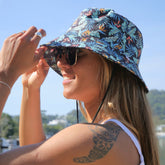 The perfect way to polish off your show-stopping Festival 'fit. Our reversible bucket hats offer two unique designs - one side featuring Jungle Fever and the other, Flamingo Nights - for a double dose of style at a single cost.