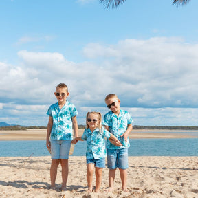 Make sure your little ones are the center of attention with the Island Blues Kids Unisex Hawaiian Shirt! Featuring fun palm tree prints on 100% cotton, this is perfect for all their summer and cruisin' adventures (don't forget to get the matching items for the whole family!).   Get ready to party under the palms! View the Island Blues Collection.