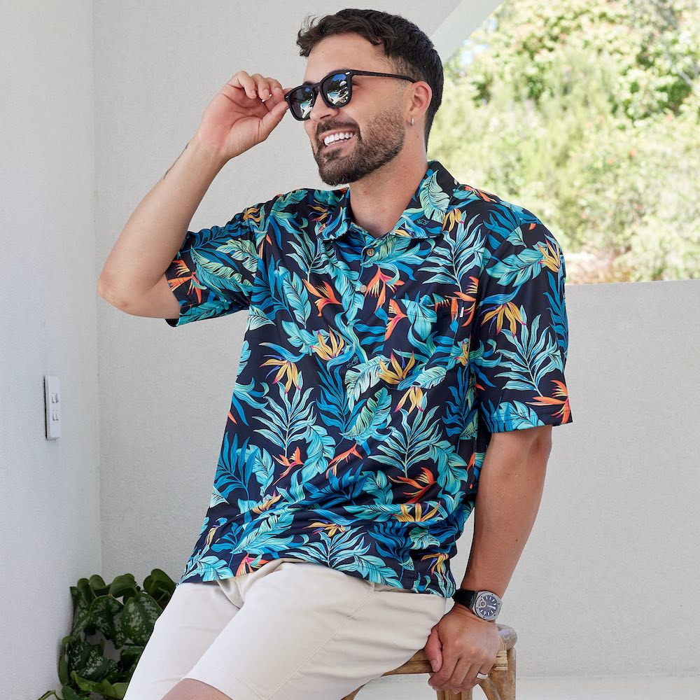 Jungle Fever is ready to make your next golf outing a wild ride! This fun polo shirt is the perfect companion for a day on the greens, with its breathable, moisture-wicking fabric to keep you cool and comfortable no matter how wild your putting gets!  The shirt is designed to give you optimal freedom of movement for a peak performance. Plus, it's stylish enough to make a fashion statement without sinking your score. Swing into action!