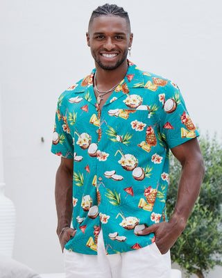 Express your tropical vibes with this Coco Crush Hawaiian Shirt. The teal base colour is punctuated by fun summer cocktails, juicy pineapples, and a hint of leafy foliage - perfect for those beachy nights out! Soft cotton and rayon blend ensures you stay stylish and comfortable all summer long.