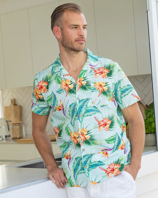 Lounge in paradise with this Green Paradise - Mens Hawaiian Shirt! This classic aloha print is made from 100% cotton - perfect for uniforms, cruises, and other tropical getaways. Make a statement and show off your sandy side in style!