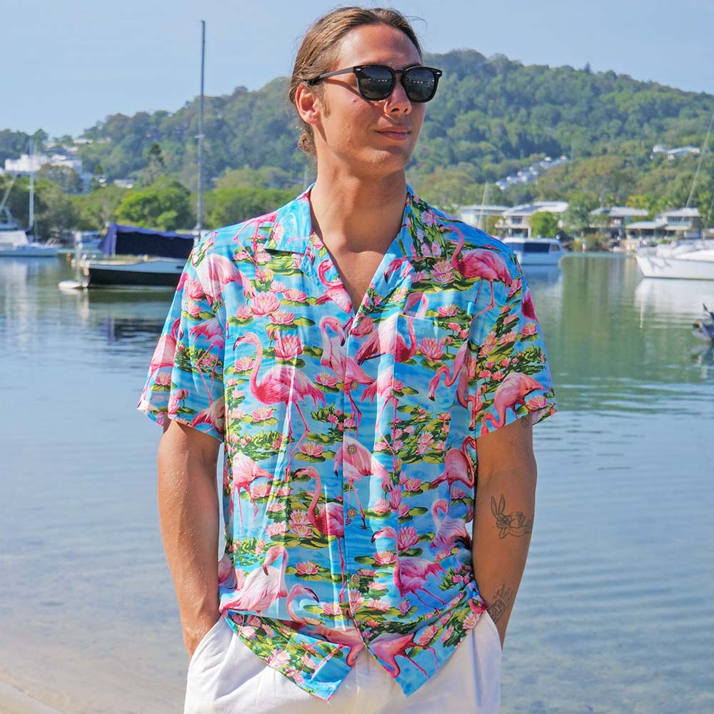 Let your aloha spirit soar with this Turquoise Flamingo Mens’ Hawaiian Shirt: a perfect combination of pink flamingo and tropical vibes for your next beach party or festival! Slip into 100% soft rayon and show your wild side! (And do it in style!)
