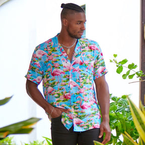 Let your aloha spirit soar with this Turquoise Flamingo Mens’ Hawaiian Shirt: a perfect combination of pink flamingo and tropical vibes for your next beach party or festival! Slip into 100% soft rayon and show your wild side! (And do it in style!)  Double up with the matching Ladies Hawaiian Shirt or go all out matching with the whole family! View the Turquoise Flamingo Collection. 