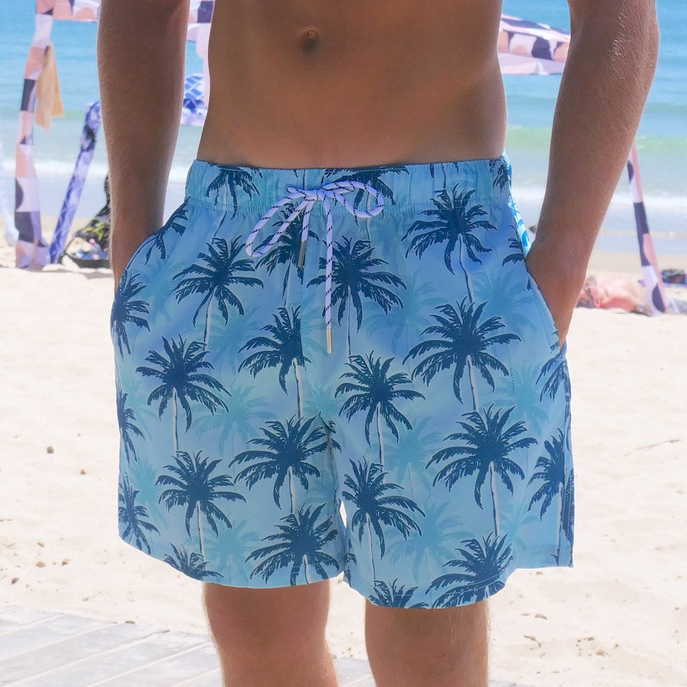 Our Island Blues - Stretch Swim Shorts are made for livin' it up in the sun! This 4 way stretch material is perfect for beach days, poolside lounging, and cruisin' the waves. Plus, the blue palm tree print kicks your summer wardrobe into high gear.