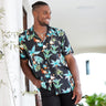 The perfect party shirt! It's cool and comfortable with a stand out flamingo and palm trees print on a black base. Double up with the matching shorts.  Take your look to the next level by adding matching Shorts, Kaftans, and Crop Shirts. View the Flamingo Nights Collection. 