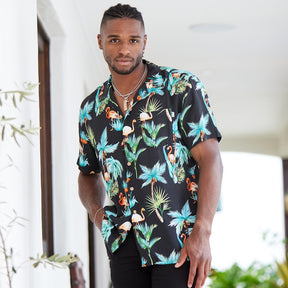The perfect party shirt! It's cool and comfortable with a stand out flamingo and palm trees print on a black base. Double up with the matching shorts.  Take your look to the next level by adding matching Shorts, Kaftans, and Crop Shirts. View the Flamingo Nights Collection. 