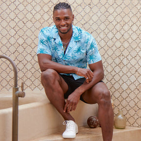 This shirt is a must-have for anyone looking to add a touch of tropical flare to their wardrobe. Featuring a modern, blue palm tree pattern printed on 100% cotton for a comfortable fit and feel. With its bright colours, unique design, and comfortable fit, you'll be sure to turn heads in this stylish Hawaiian shirt.  Add a touch of island vibes to your wardrobe today! Shop the collection.