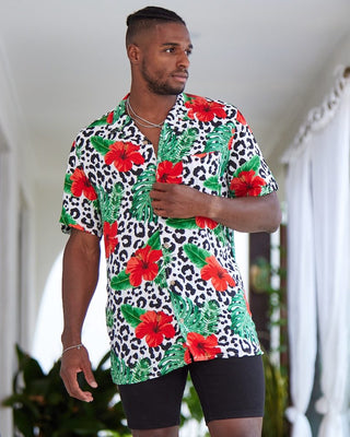 Looking for a stylish and eye-catching shirt for your next festival? Check out the Party Animal Mens Shirt in leopard print with vibrant hibiscus flowers and monstera leaves! This shirt is sure to make you stand out in the crowd with its bold and fun design. The lightweight and breathable material ensures you stay comfortable in warm weather, while the relaxed fit allows for easy movement while dancing or socialising.