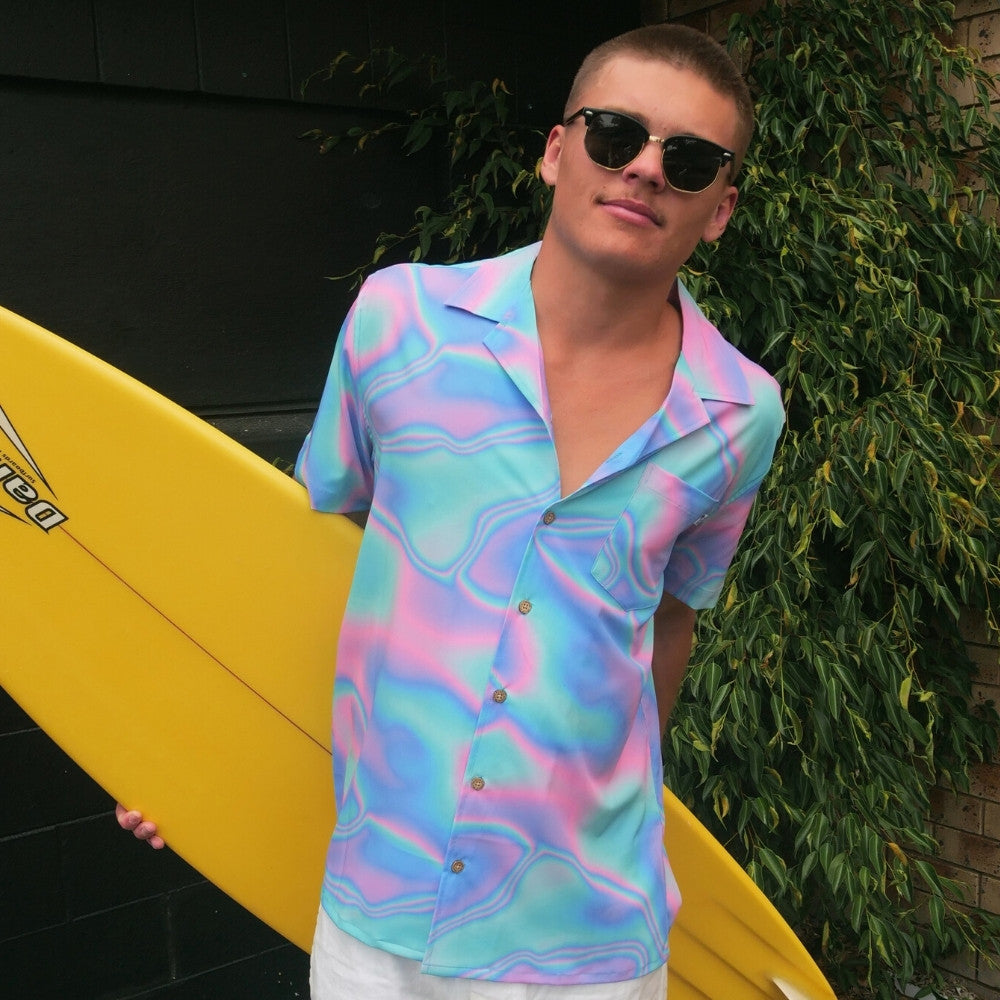 Lucid Dreams; a modern Psychedelic twist to a Hawaiian shirt. Beach season meets festival season! Intense bright colours because you don't have to be woke to make a statement with fashion.Lucid Dreams; a modern Psychedelic twist to a Hawaiian shirt. Beach season meets festival season! Intense bright colours because you don't have to be woke to make a statement with fashion.  Level up the look and add matching Swim Shorts or Bucket Hat. View the Lucid Dreams Collection. 