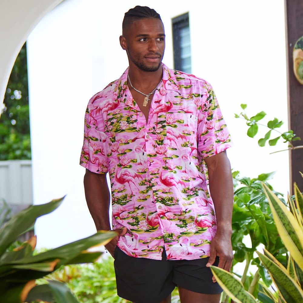 This classic men's Hawaiian shirt features vibrant pink flamingos printed on 100% rayon fabric. Complete with coconut buttons, it's perfect for a stylish yet comfortable island-style look. Steal the spotlight everywhere you go.  Go all out matching with the whole family! Shop the Pink Flamingo Collection. 