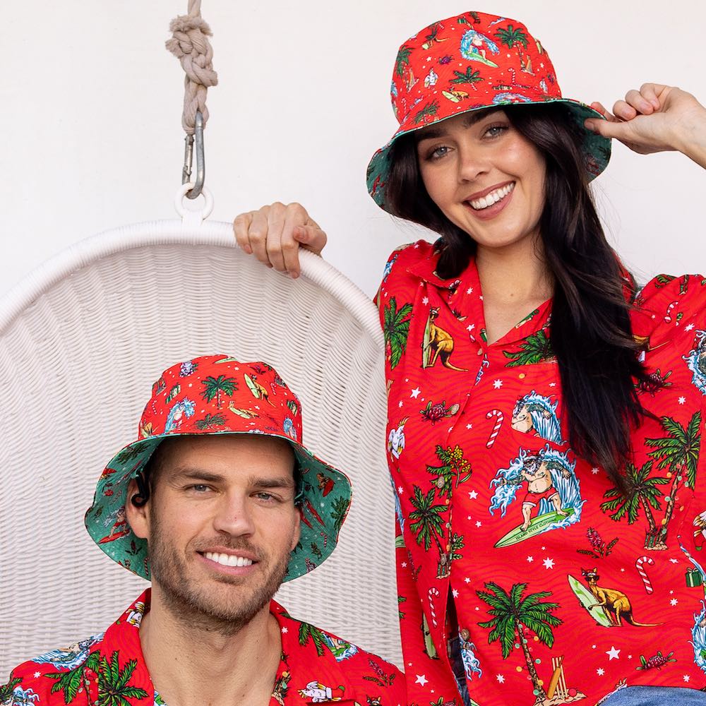 We heard on the bush telegraph that Island Style Clothing has new Christmas designs! Dive into the festive spirit with this Aussie Christmas Red Bucket Hat!  Red one side and green the other. You'll be spreading cheer and keeping the sun out of your eyes with its reversible design. New improved model now has a detachable chin strap that clips on both sides. You can wear this one on a windy beach or at a festival and it won't blow off.  So, get your hat on and get ready for a ho-ho-holiday season!