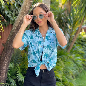 Let yourself feel the island vibes with this unique blue aloha shirt. The classic Hawaiian pattern with palm trees will have you feeling like a beachcomber even in corporate headquarters!  100% cotton ensures a comfortable fit for all day wear, whether you’re heading out on a cruise or to the office. It's truly a shirt "to-tally" worth getting your hands on!