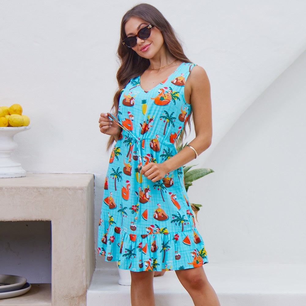 Ready to make a splash this holiday season? Our Christmas Pool Party dress is the perfect way to make a statement that's sure to be remembered. With a festive print and lots of sass, it's the perfect 'lil number for a party on the pool deck! Boom!  This dress features a soft v-neck, adjustable (non-elastic) waist tie, and ruffled hem. 100% Rayon.