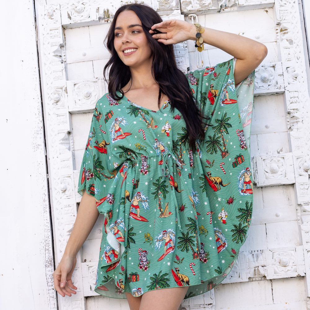 You know you look good when the Christmas Tree starts blowing kisses. Enjoy the perfect festive look with this Xmas Kaftan. Made with lightweight natural fabric, this cover-up is designed to keep you protected from the sun's rays while providing a beautiful tropical aesthetic. Ideal for Christmas days spent at the beach, tropical parties, or your upcoming Xmas cruise.