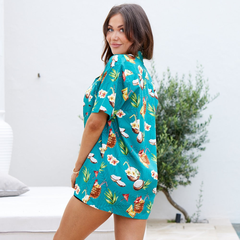 Experience the taste of tropical paradise with Coco Crush! This unique, unisex Hawaiian shirt features a teal base with a subtle leaf design, decorated with coconuts and pineapples to bring a splash of sunshine to your wardrobe.