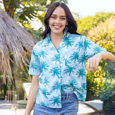 Sport your island look with this Island Blues Women's Hawaiian shirt. Perfect for a cruise or an aloha-inspired uniform, this 100% cotton shirt is that tropical paradise you've been dreaming of! With an eye-popping palm tree print in classic blues, it will have you ready for some sweet island vibes. Aloha!