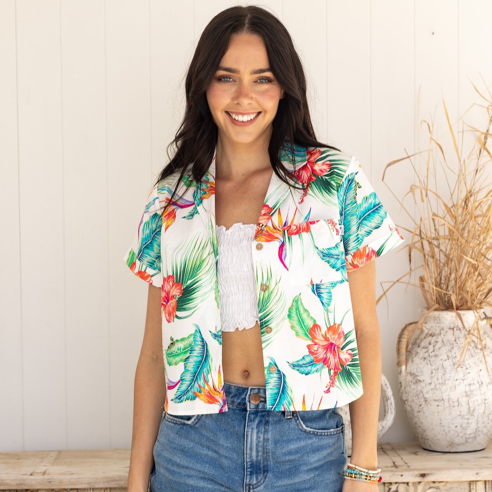 Kick up your wardrobe game with White Paradise! This Women's Crop Hawaiian Shirt is perfect for those who crave for the classic yet modern aloha print. 100% cotton for lasting comfort and style - it'll feel like paradise right on your shoulders!