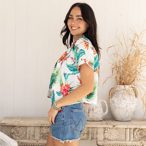 Kick up your wardrobe game with White Paradise! This Women's Crop Hawaiian Shirt is perfect for those who crave for the classic yet modern aloha print. 100% cotton for lasting comfort and style - it'll feel like paradise right on your shoulders!