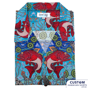 Customised Shirts made for Kuku Bulkaway Indigenous Art Gallery, Cooktown, FNQ. They paint stories they were taught as children about the local bush, food and animals.  They supplied photos of their hand-painted art (original paintings you can view in our photo gallery). From there our clever design team created a seamless pattern and we turned them into wearable art on shirts and shorts. Deadly style! Main feature is Coral Trout 100% Cotton Hawaiian Shirts and Shorts