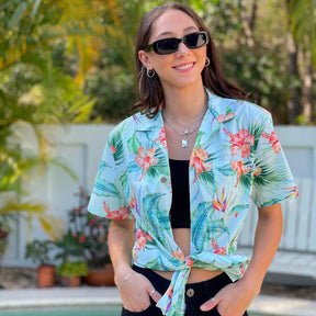 A classic aloha design and a mint green base color make this Green Paradise Unisex Cotton Hawaiian Shirt the perfect pick for any adventure! With hibiscus and bird of paradise accents, you'll put a tropical spin on any holiday, corporate uniform, or cruise.  100% cotton means it's comfy and stylish! Look sharp and stay cool, now that's paradise!
