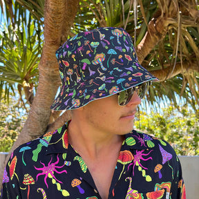 Bringing you the perfect way to polish off your show-stopping Festival 'fit. Get two for the price of one with our reversible bucket hats. One side is our Lucid Dreams and the other side is Magic Mushrooms. Not mushroom for improvement, is there? Intense bright colours because you don't have to be woke to make a statement with fashion. Level up the look with the Matching Mens or Unisex Sets Magic Mushrooms Reversible design - Lucid Dreams on the flipside 100% Polyester Brim width - 6cm