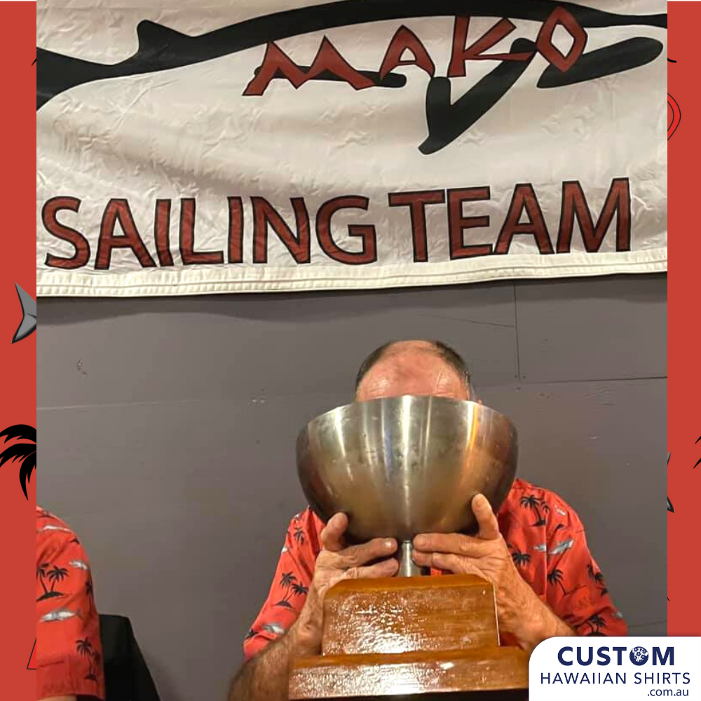 a man covering his face with a metal bowl