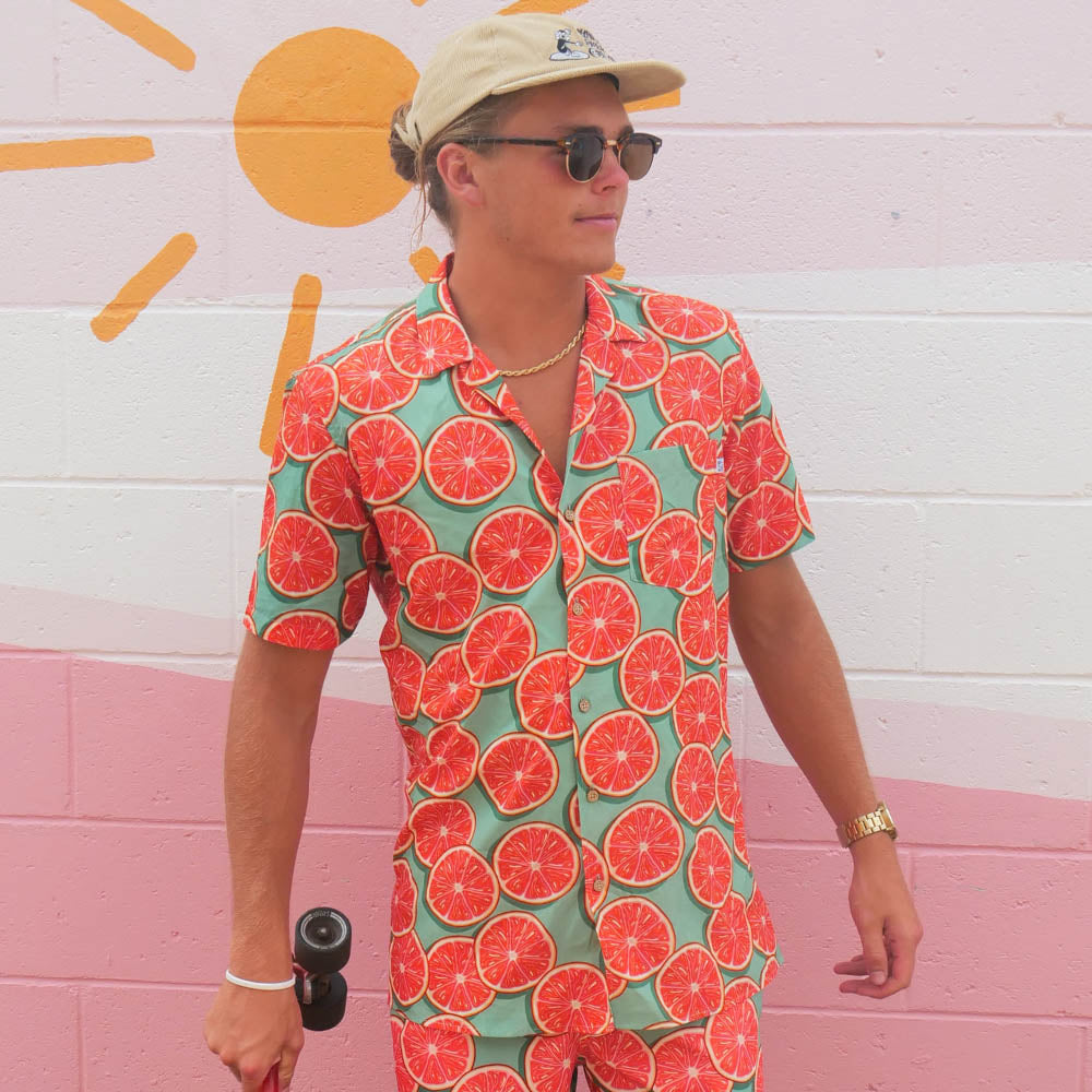 Groovy Grapefruit Party Shirt Mens Hawaiian Resort Festival Fun AustraliaUnapologetically fruity. Get a taste of this Groovy Grapefruit Shirt! It's giving summer vibes. Whether it’s days at the beach, nights out with friends, festivals, or backyard barbecues, you'll be turning heads.  Level up the look with matching Shirts and Bucket Hat. Shop the Groovy Grapefruit collection.
