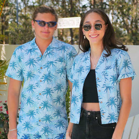 Let your style sail off into the wild blue yonder with our Island Blues Hawaiian Shirt! This modern take on island style is crafted from 100% cotton for a fresh and breezy look, while its striking blue design featuring palm trees brings a sunny, tropical feel to any look. Perfect for uniforms, cruises, or just chillin' out with friends!