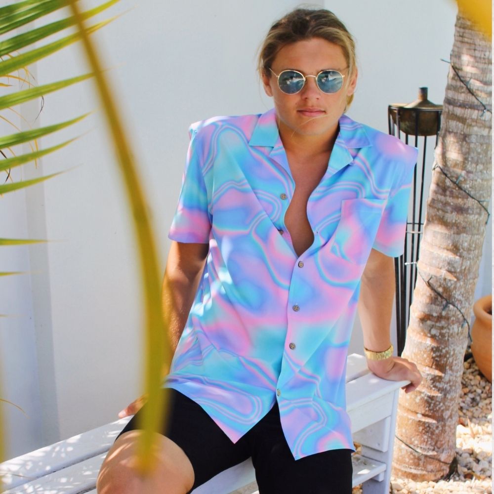 Lucid Dreams; a modern Psychedelic twist to a Hawaiian shirt. Beach season meets festival season! Intense bright colours because you don't have to be woke to make a statement with fashion.Lucid Dreams; a modern Psychedelic twist to a Hawaiian shirt. Beach season meets festival season! Intense bright colours because you don't have to be woke to make a statement with fashion.  Level up the look and add matching Swim Shorts or Bucket Hat. View the Lucid Dreams Collection. 