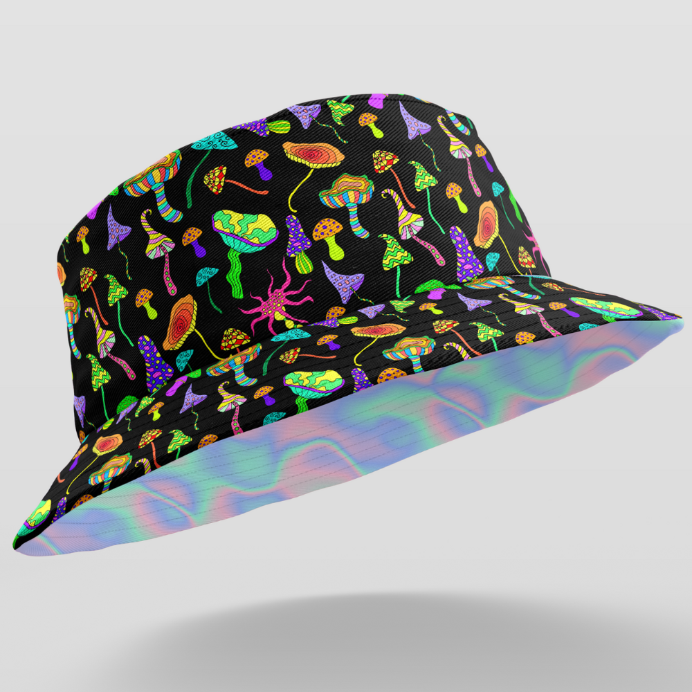 Bringing you the perfect way to polish off your show-stopping Festival 'fit. Get two for the price of one with our reversible bucket hats. One side is our Lucid Dreams and the other side is Magic Mushrooms.  Level up the look with the Matching Shirt or Wrap Top  Lucid Dreams - Holographic Swirl Print Reversible design - Magic Mushrooms on the flipside 100% Polyester Brim width - 6cm