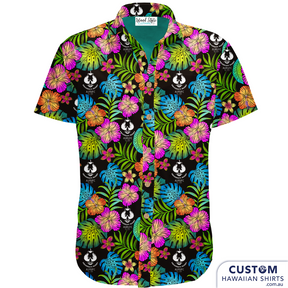Adelaide University Rugby Football Club - Team Uniforms. They wanted a black base with very graphic multi-coloured floral print and their logo scattered throughout. This surely was eye-catching as touring shirts or after game events. 100% Cotton Coconut buttons